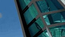 a building with a lot of windows and a blue sky in the background