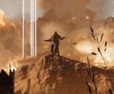 a man standing on top of a rock with his arms outstretched in front of an explosion