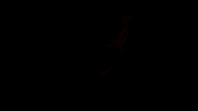 a pink heart is drawn on a dark background