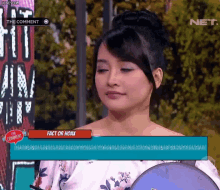a woman on a tv show with the caption " fact or hoax " on the screen