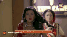 an ad for sony television shows a woman in a red dress