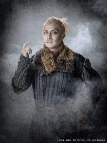 a man with a mustache and a ponytail is wearing a sweater and a scarf