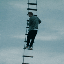Climbing The Rope Ladder Ed Sheeran GIF - Climbing The Rope Ladder Ed Sheeran Going Up GIFs
