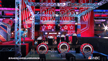 a nbc advertisement for american ninja warrior shows a stage