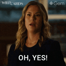 a woman in a black shirt is saying oh yes .