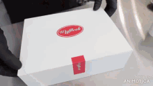 a white box with a red label that says waffleck on it