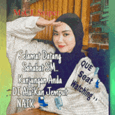 a woman wearing a hijab and a striped shirt with que seat watching written on it