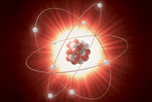 a model of an atom with red and white spheres around it