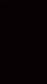 a dark background with a lot of gold sparkles coming out of it