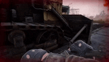 a person is standing next to a bulldozer in a video game .