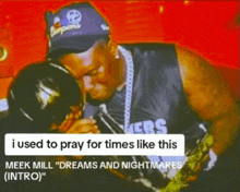 a man kissing a trophy with the words " i used to pray for times like this meek mill dreams and nightmares intro "
