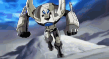 a robot with horns is standing on top of a snow covered hill .
