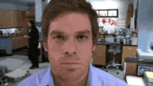 a close up of a man 's face in a lab