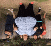 a group of people are posing for a picture with a very large woman in the center .