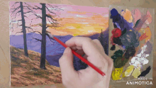 a person is painting a sunset with the words made in animotica below them