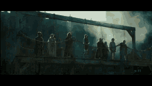 a group of soldiers are standing in a line holding their guns