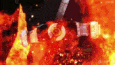 a person is standing in front of a fire with a belt around their waist