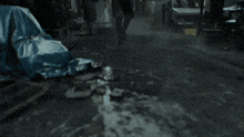 a blurry picture of a person walking in a puddle