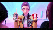 a girl in a yellow jacket is holding two cups of coffee and giving a middle finger .