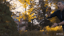 a netflix ad shows a man throwing a frisbee