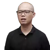 a bald man wearing glasses and a black shirt is making a face