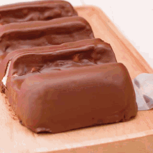 a close up of a chocolate bar on a wooden surface