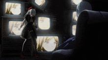 a girl in a red hat is standing in front of a wall of televisions