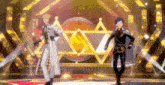 a couple of anime characters are standing on a stage .