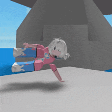 a girl in a pink shirt and blue pants is laying on the ground
