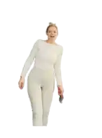 a woman in a white top and white pants is smiling