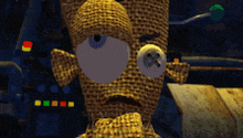 a cartoon character with a big eye and a button on his nose