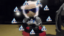 a stuffed doll wearing sunglasses sits on a chair