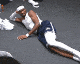 a man laying on the floor with a headband on