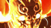 a close up of a person 's face with flames coming out of it 's eyes