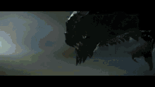 a close up of a monster in the dark with a blurred background