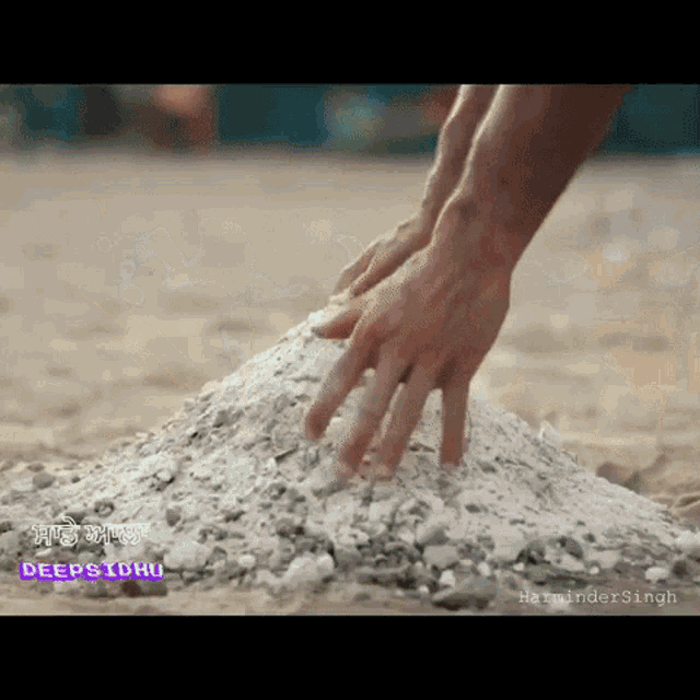 a close up of a person 's hand on a pile of dirt with the words deepsidhu visible