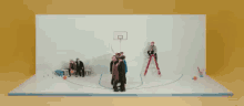 a group of people are playing basketball in a circle .
