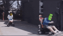 a person is riding a lawn mower with a robot head on it