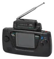 a sega game gear tv tuner with a radio attached to it