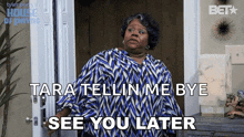 a woman in a blue and white shirt says tara tellin me bye see you later .