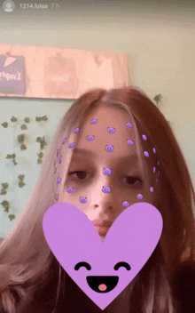 a girl with purple dots on her face and a purple heart behind her
