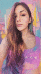 a woman with rainbow hair is wearing a purple tank top that says dno on it