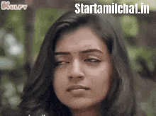 a close up of a woman 's face with the words starttamilchat.in written on the bottom