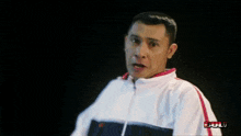 a man in a white jacket is holding a piece of paper that says " bull " on it