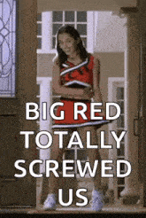 a cheerleader in a red and black uniform is standing in front of a door .