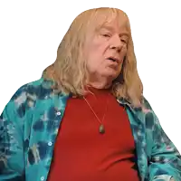 a man with long blonde hair wearing a tie dye shirt and a red shirt