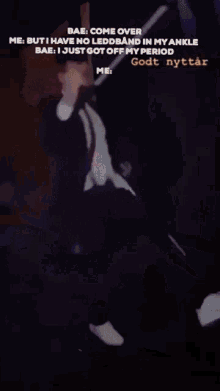 a blurry picture of a man in a suit and tie with the words bae come over me