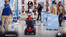 Riding A Cart Superstore GIF - Riding A Cart Superstore Driving Along GIFs