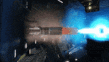 a close up of a bullet with a blue light coming out of it