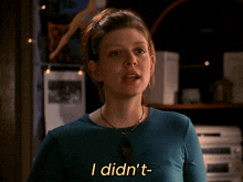 a woman in a blue shirt says that you were coming in yellow letters